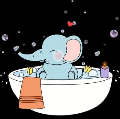 Elephant bathing in a white tub with bubbles