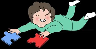 Woman lying on the floor working on jigsaw pieces