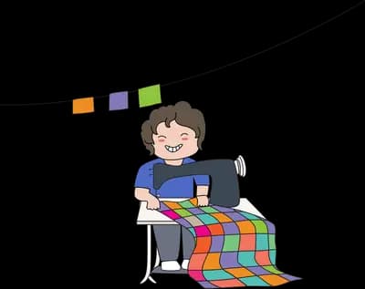 Person working at a desk under a string of bunting
