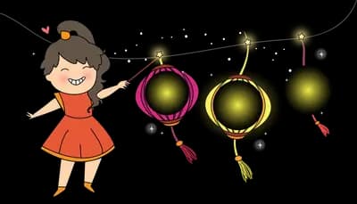 Girl in orange holding festive lanterns on poles