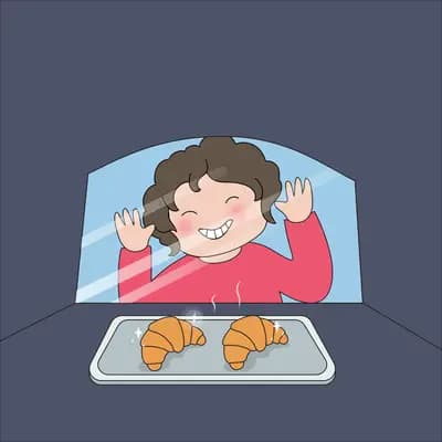 Girl pressing against a bakery window looking at croissants on a tray