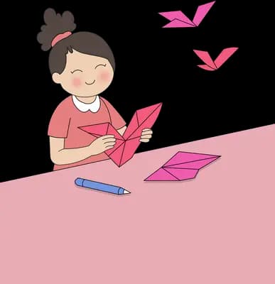 Girl folding pink paper into origami birds at a pink desk
