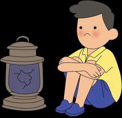 Boy sitting hugging his knees beside a dark unlit oil lantern
