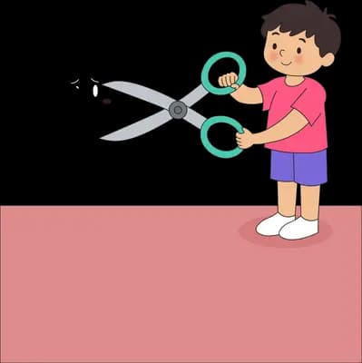 Boy cutting a black scribble apart with giant scissors