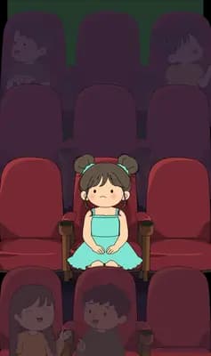 Two children seated in a dim cinema row eating popcorn