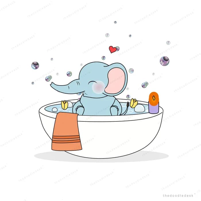 Elephant bathing in a white tub with bubbles