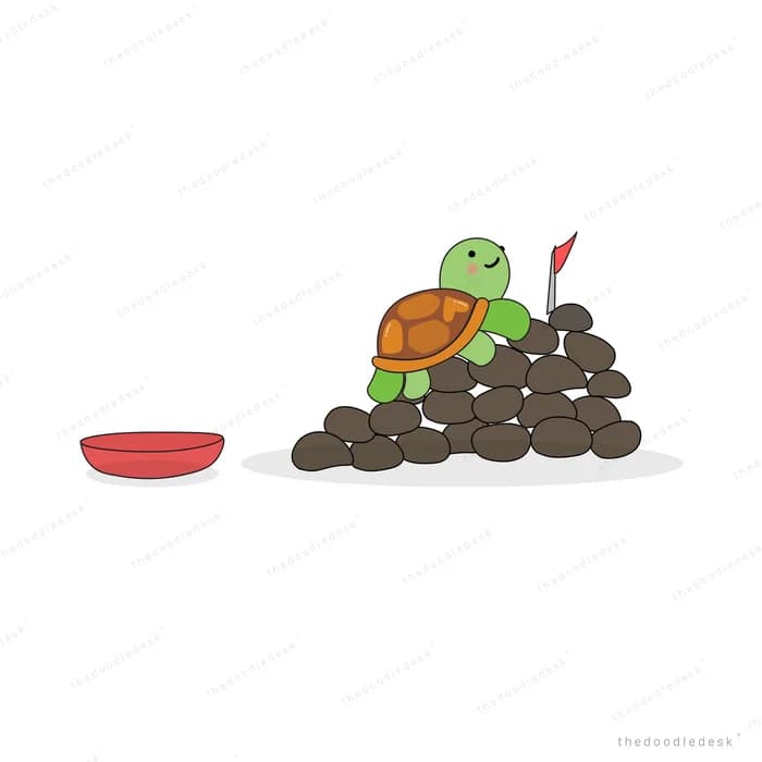 Turtle atop a mound of dark soil