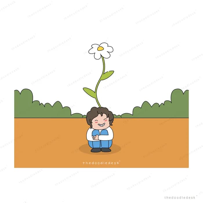 Boy sitting beneath a tall flower on brown ground