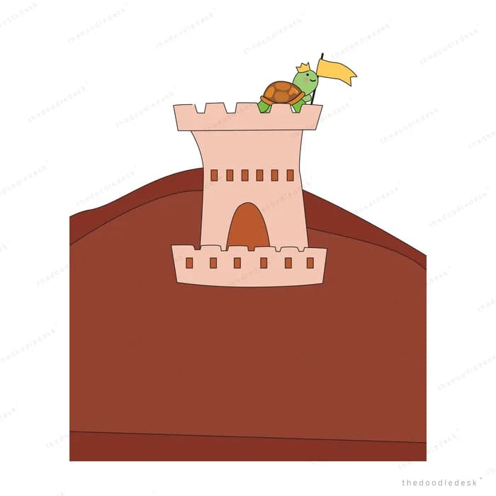 Sandcastle with flags on brown ground