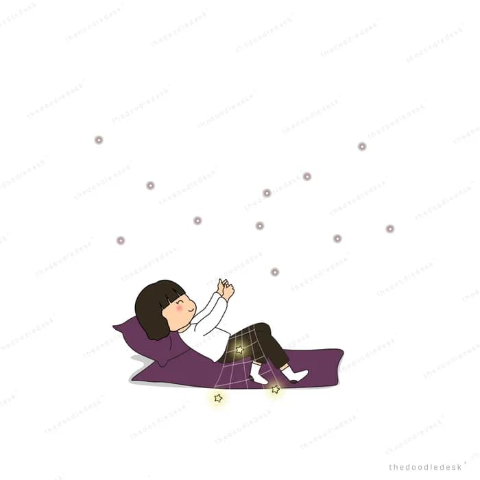 Girl lying on a mat reaching toward floating dots
