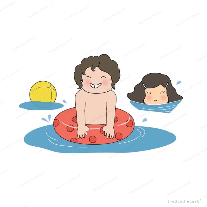Two children floating in swim rings at sunset