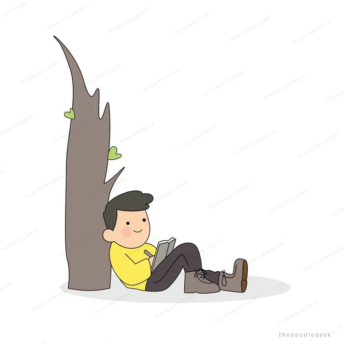 Man sitting against a tree trunk reading a book