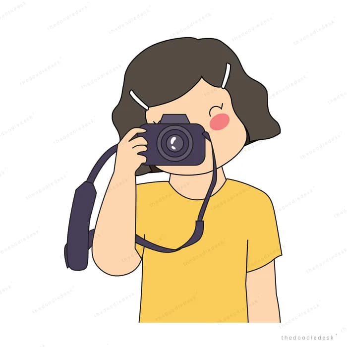 Woman in a yellow tee raising a camera to her eye to take a photo