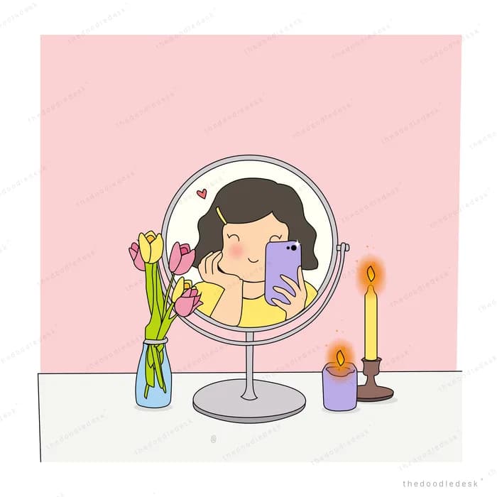 Girl taking a phone photo of herself in a vanity mirror beside tulips and candles