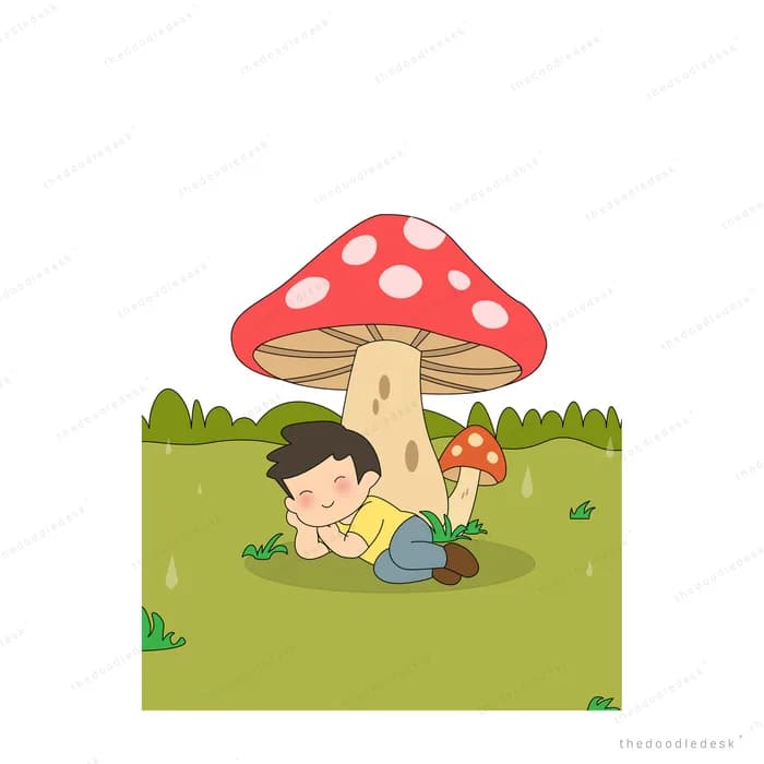 Boy lying reading a book under a large red toadstool mushroom