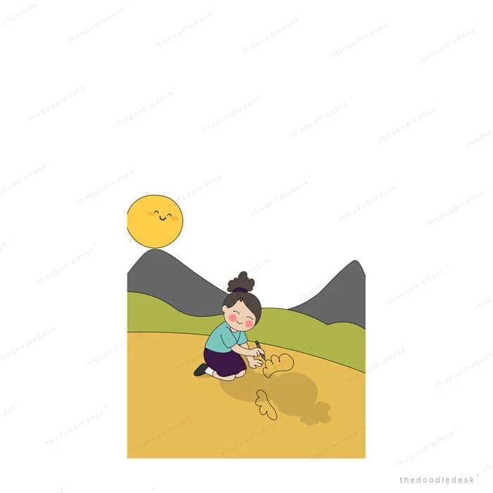 Boy digging in sandy ground on a hillside with the sun over the mountains