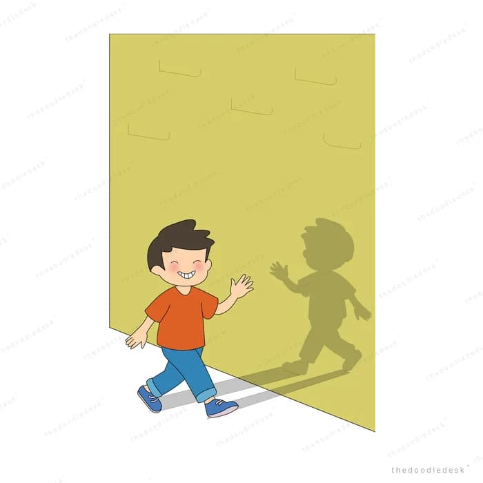 Boy running along a yellow wall with his own shadow chasing him