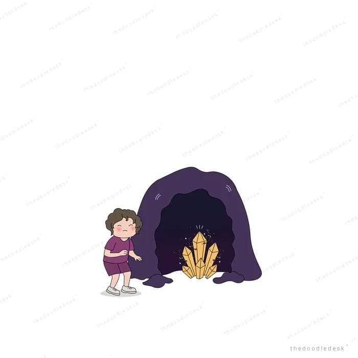 Girl kneeling at the mouth of a dark cave beside a small fire