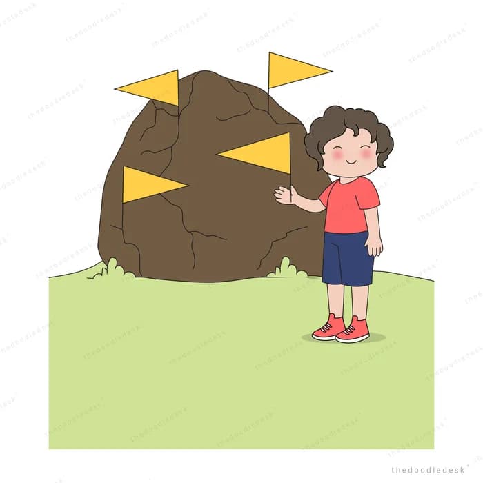 Boy pulling yellow wedges out of a big brown boulder on a green lawn