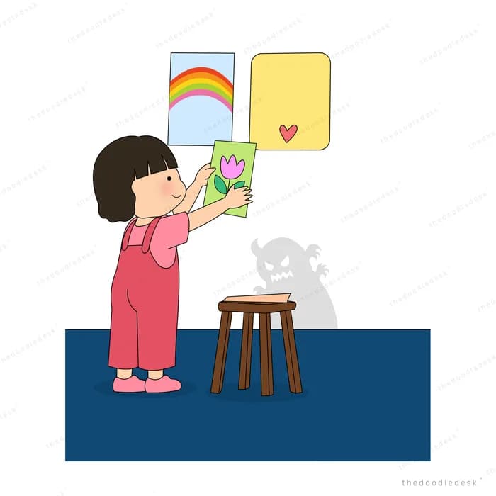 Girl pinning up rainbow, heart and tulip drawings that hide the shadow