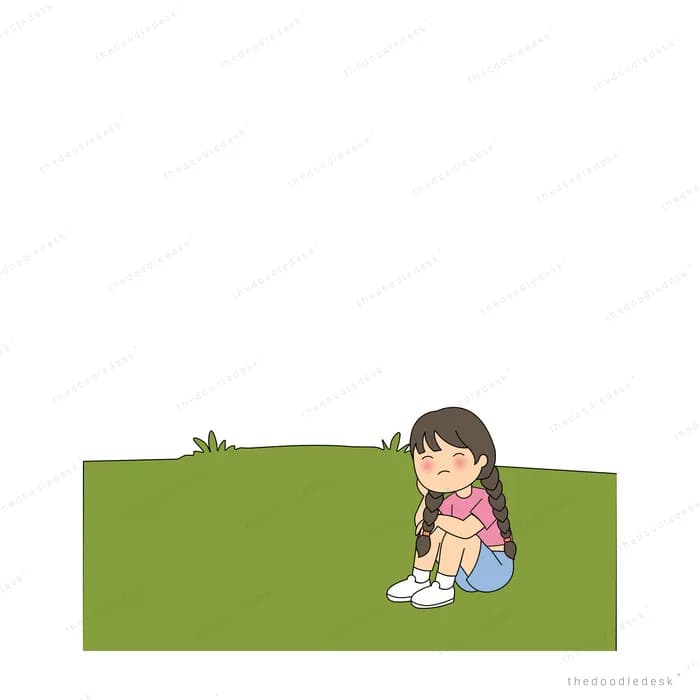 Girl sitting alone on a green field
