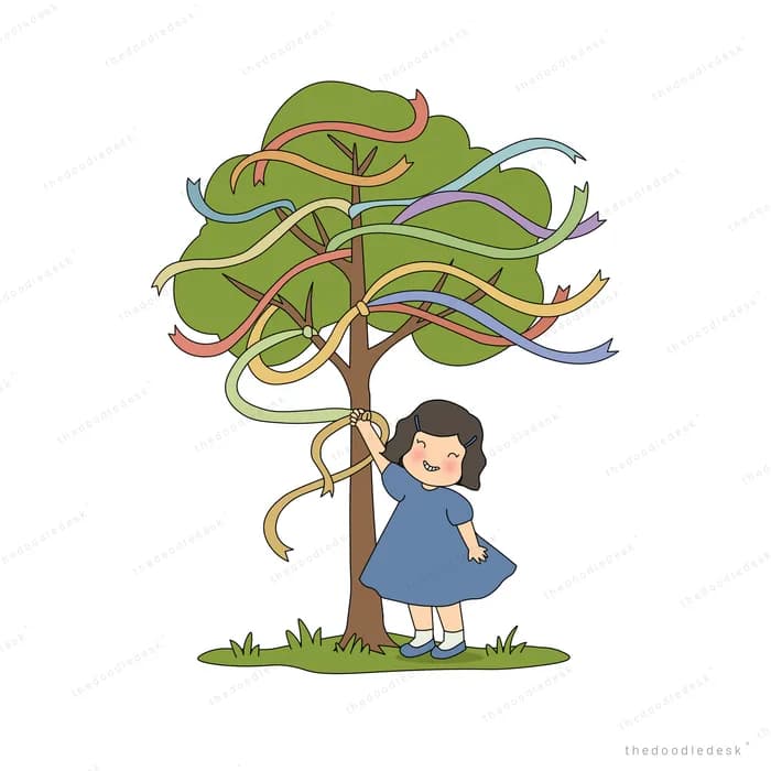 Girl swinging upside down from coloured ribbons tied around a tree