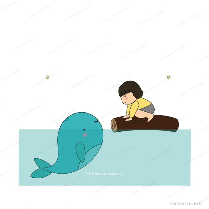 Boy resting on a plank beside a large whale