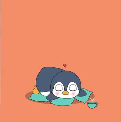 Penguin lying on a green mat with a heart