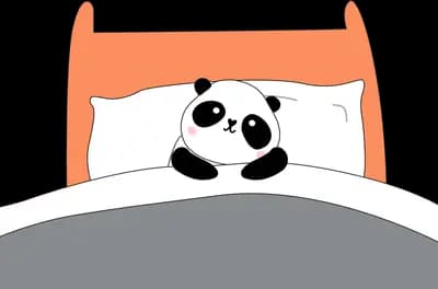 Panda asleep in an orange bed