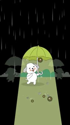 White dog sitting under a green umbrella in a cone of light framed by dark bushes