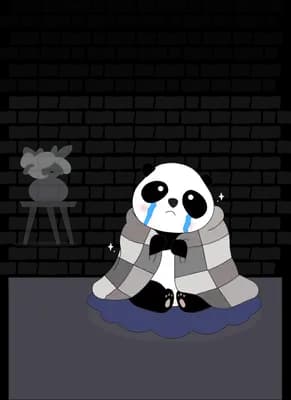 Panda in a blue scarf huddled under a checkered blanket on a rug against a brick wall
