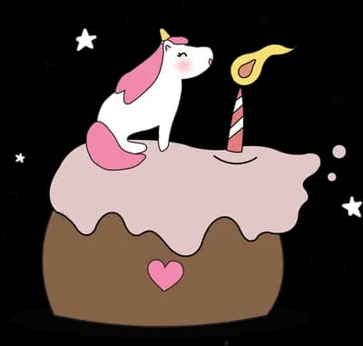 Birthday cake topped with a unicorn and candle