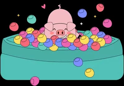 Baby sitting in a ball pit of colourful balls