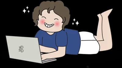 Boy lying on his front using a laptop