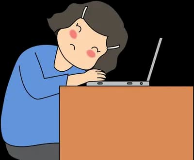 Woman slumped over a laptop at a desk