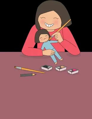 Woman working at a desk while holding a baby