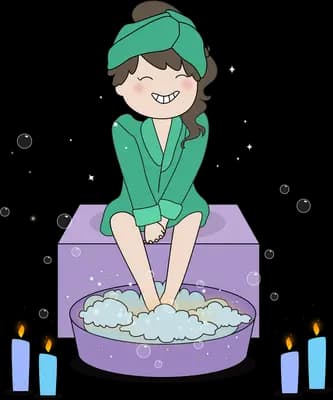 Woman in a green robe and hair towel soaking her feet in a foot spa beside candles
