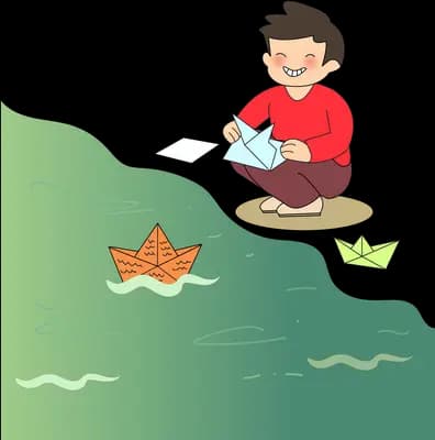 Boy kneeling on a green bank folding paper boats and floating them on the water