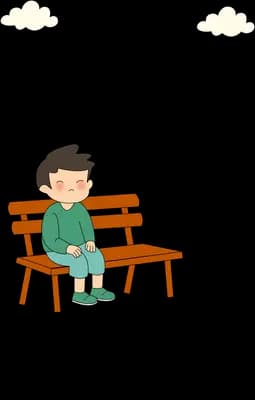 Boy sitting alone on a wooden bench with a long shadow behind him
