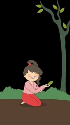 Girl kneeling in a soil bed beside a bare young tree