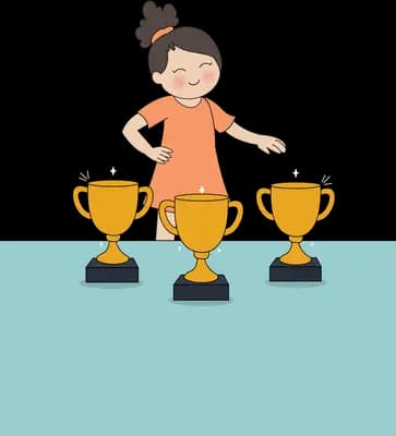 Girl standing behind a table displaying three gold trophies