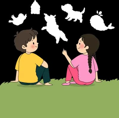Boy and girl sitting on the grass facing each other in conversation