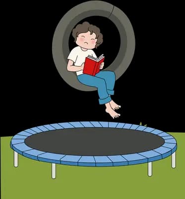 Boy reading in a tyre swing hanging above a blue trampoline
