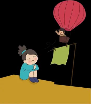 Boy slumped on a hill watching a red hot air balloon rise past a green flag