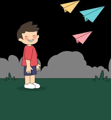Boy looking down as coloured paper planes fly away above him