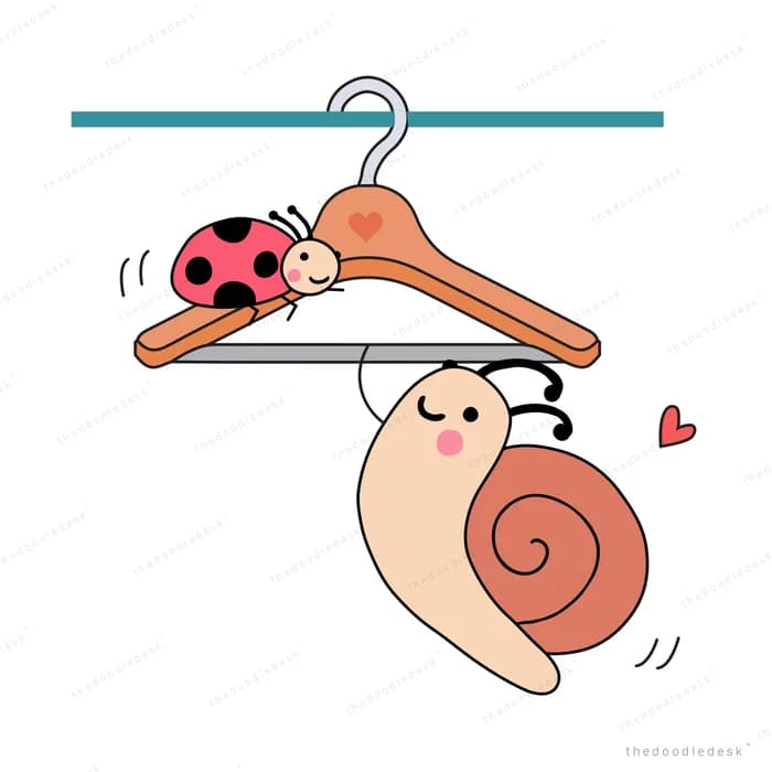 Snail hanging from a clothes hanger rail