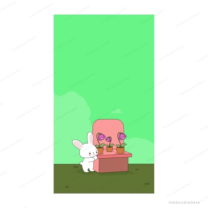 Pale pink armchair with a small cat against a green backdrop