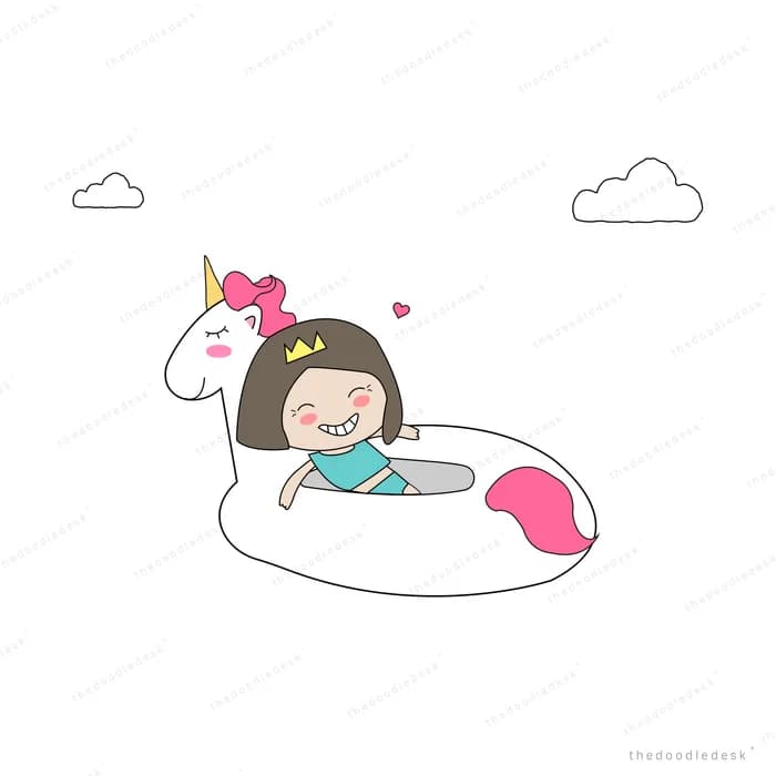 Girl floating in a unicorn swim ring