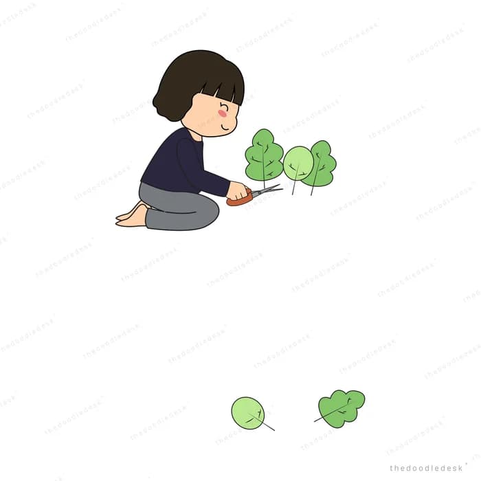 Girl kneeling and trimming small green shrubs with scissors
