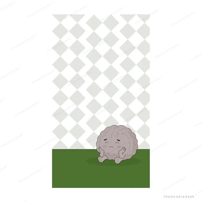 A single grey rock resting on a narrow strip of green grass